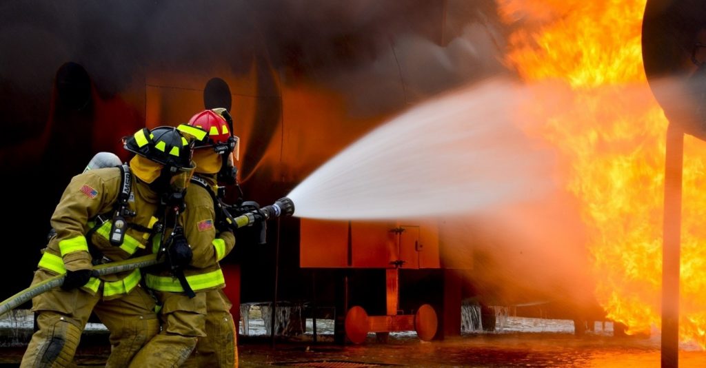 Fire fighters putting out a fire