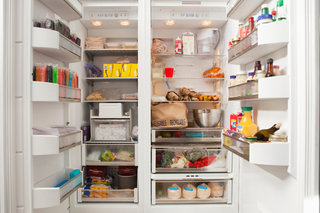 open refrigerator and freezer filled with food